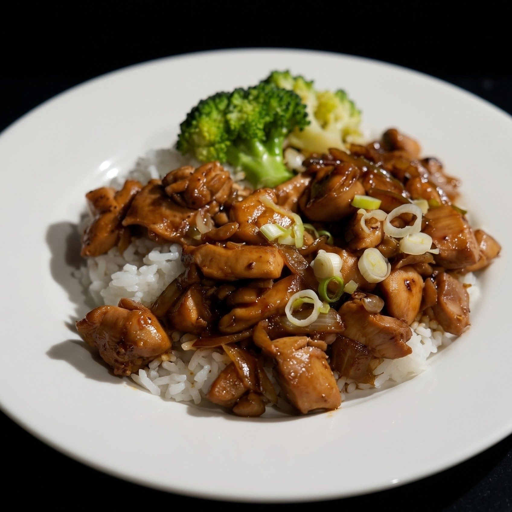 Black Pepper Chicken Over Rice.